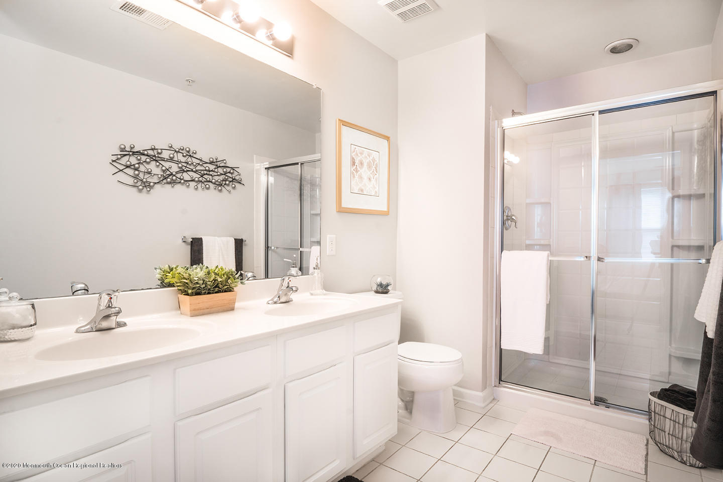 912 Timber Ridge Court Neptune Township, NJ 07753 - Photo 15 of 21 a bathroom with a double vanity sink mirror and toilet