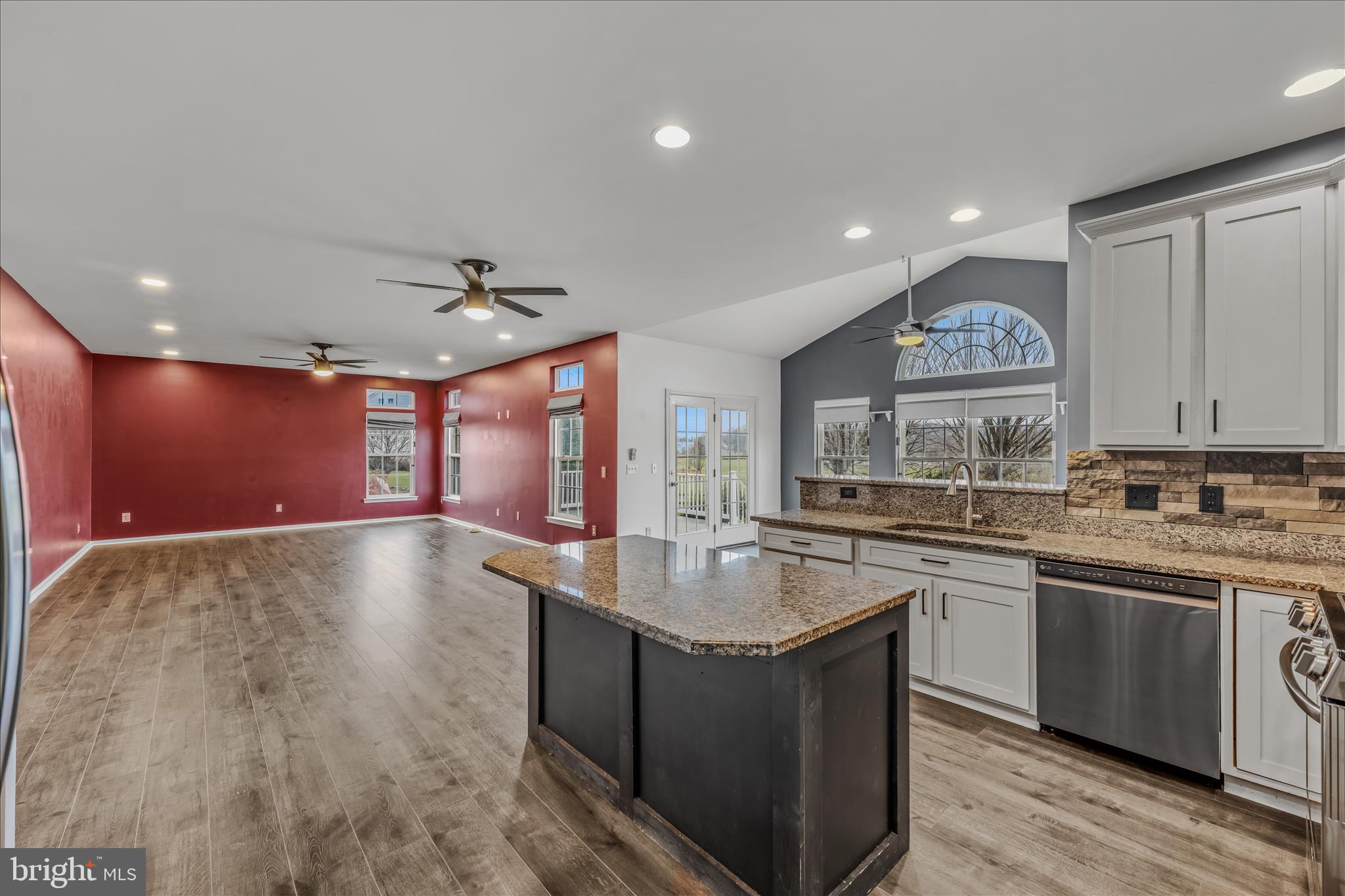 109 Turnberry Drive Charles Town, WV 25414 - Photo 13 of 77 a large kitchen with stainless steel appliances granite countertop a sink counter space and a stove top oven