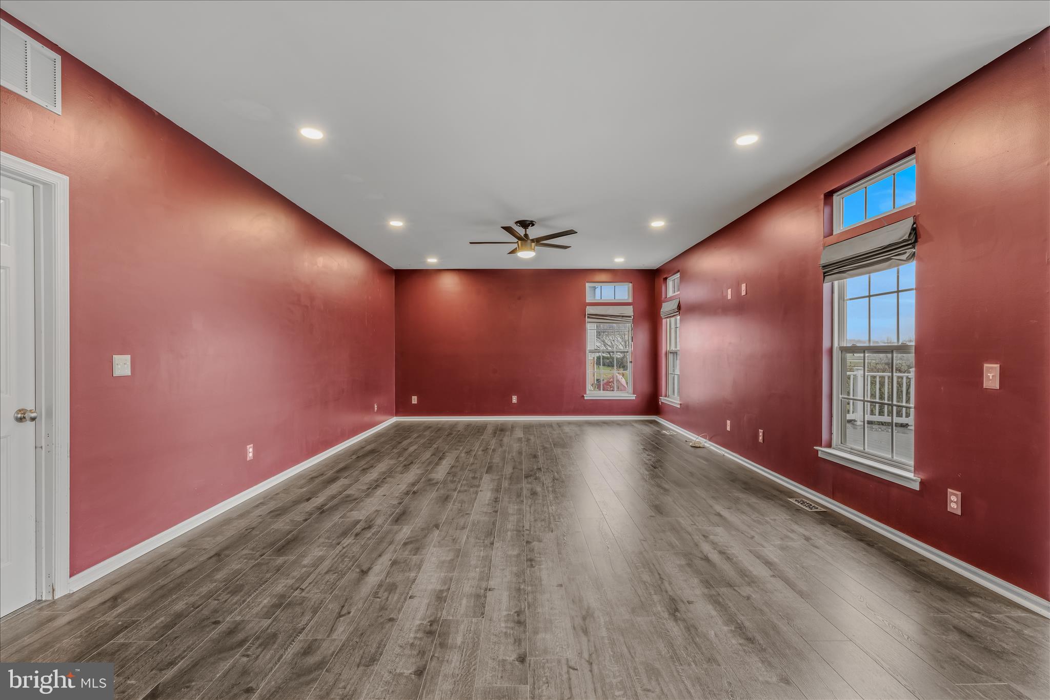 109 Turnberry Drive Charles Town, WV 25414 - Photo 15 of 77 an empty room with wooden floor and windows