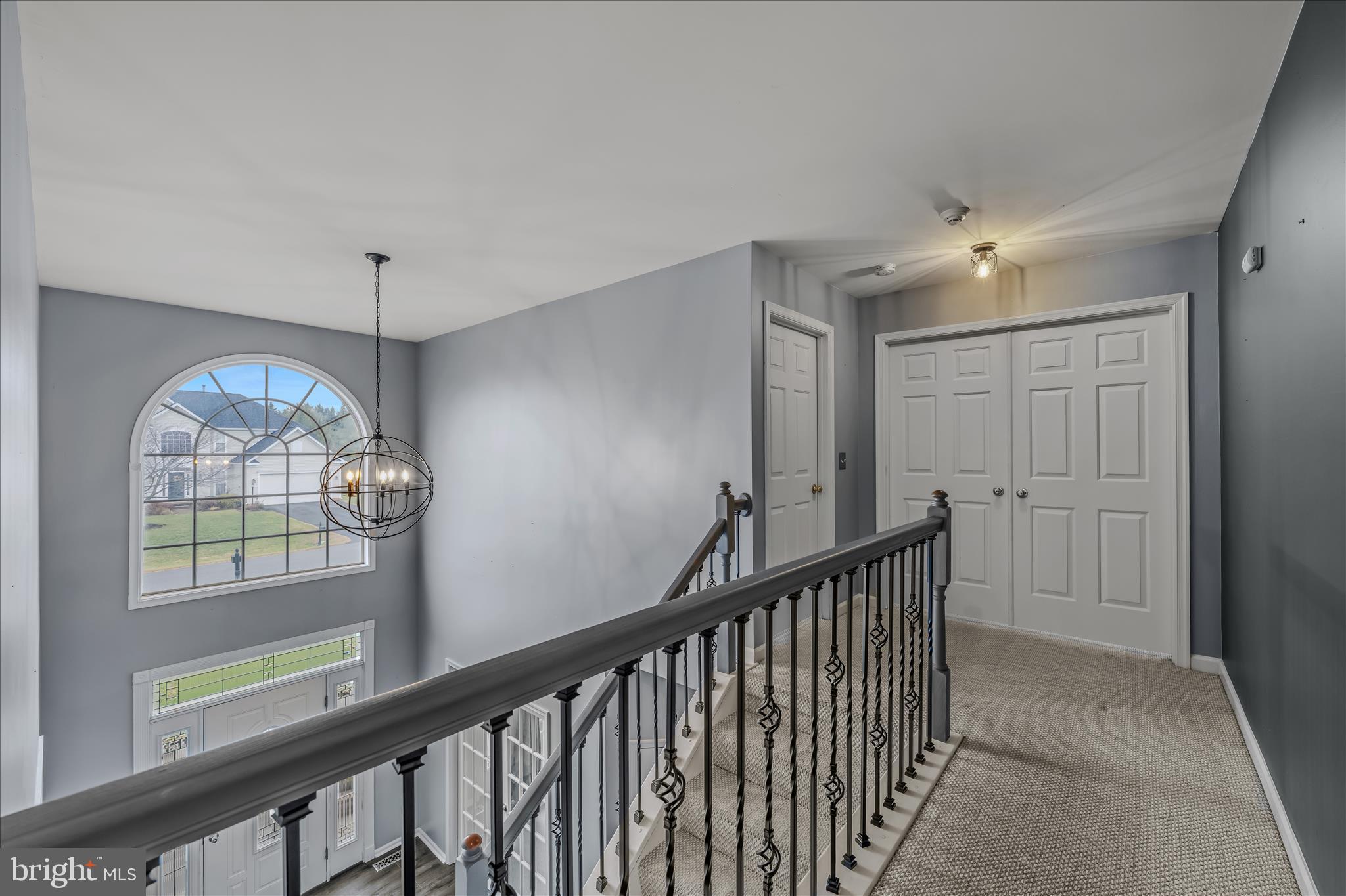 109 Turnberry Drive Charles Town, WV 25414 - Photo 23 of 77 a view of an entryway door wooden floor and chandelier