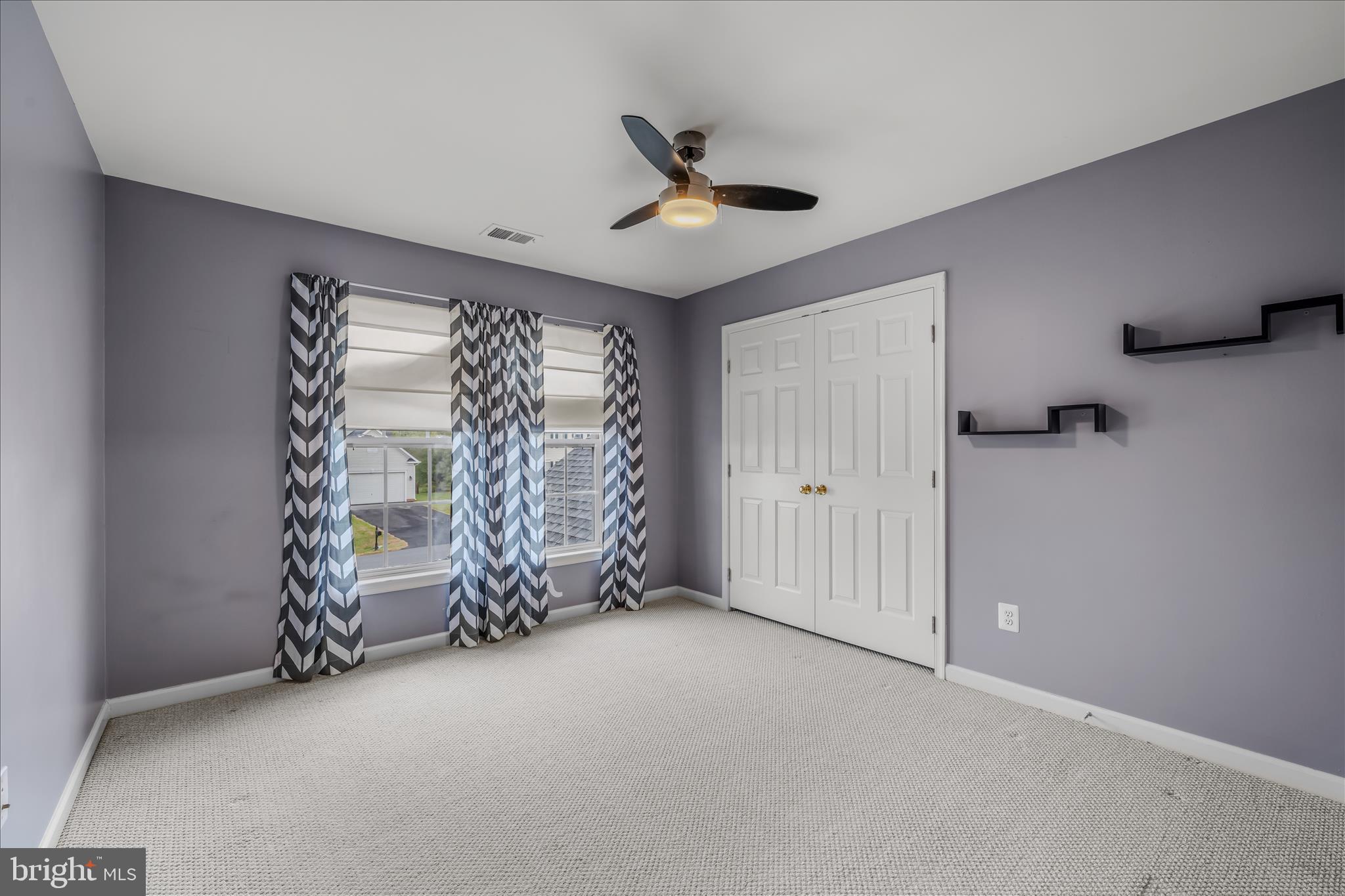 109 Turnberry Drive Charles Town, WV 25414 - Photo 30 of 77 an empty room with a ceiling fan and window