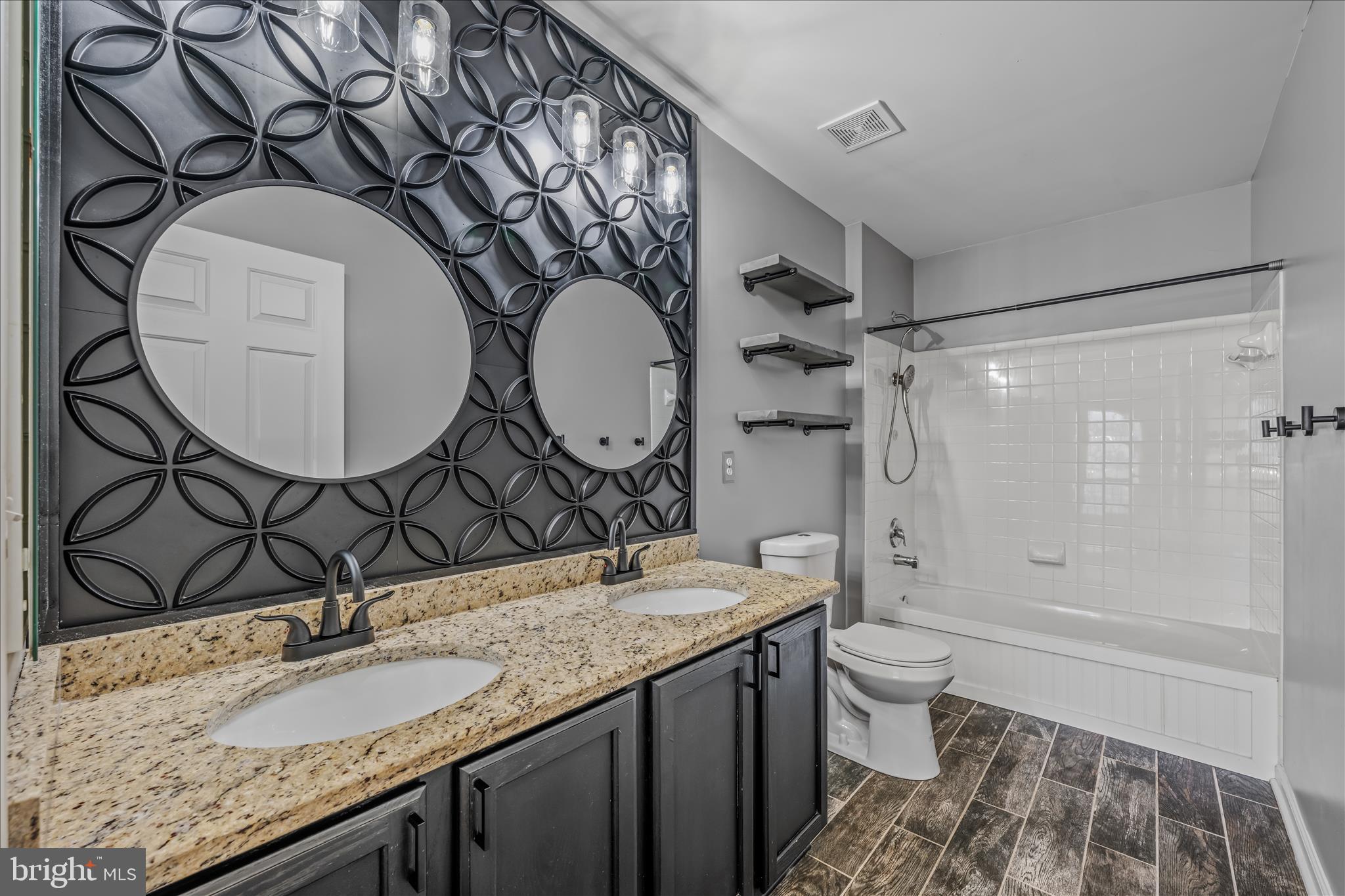 109 Turnberry Drive Charles Town, WV 25414 - Photo 32 of 77 a bathroom with a granite countertop sink mirror vanity and toilet