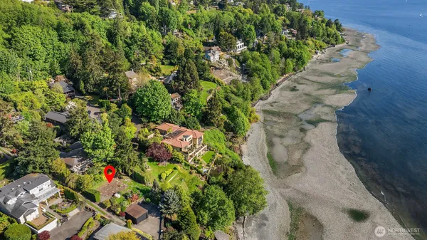 an aerial view of a house with a yard and garden