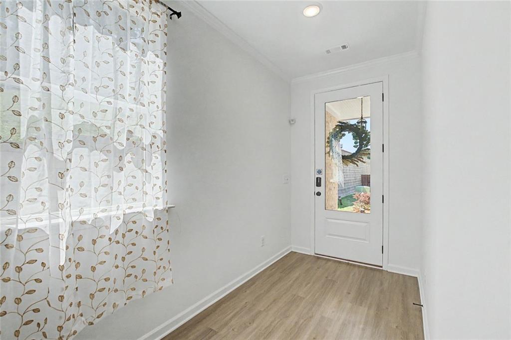 2310 Portrush Way Southeast Atlanta, GA 30339 - Photo 6 of 38 wooden floor in a empty room