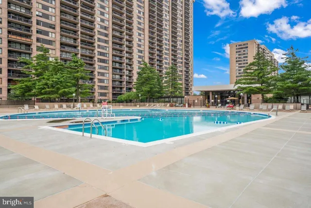 a view of a swimming pool and a yard