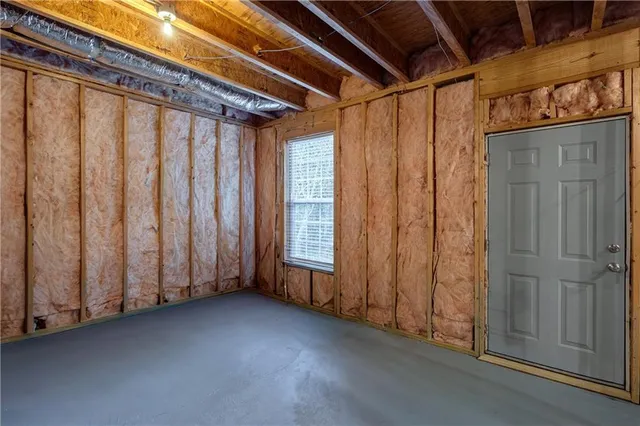 a view of a room with wooden walls