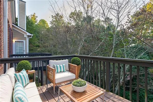 a view of balcony with furniture