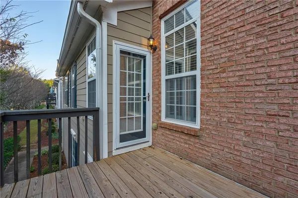 a view of a brick house with a large window