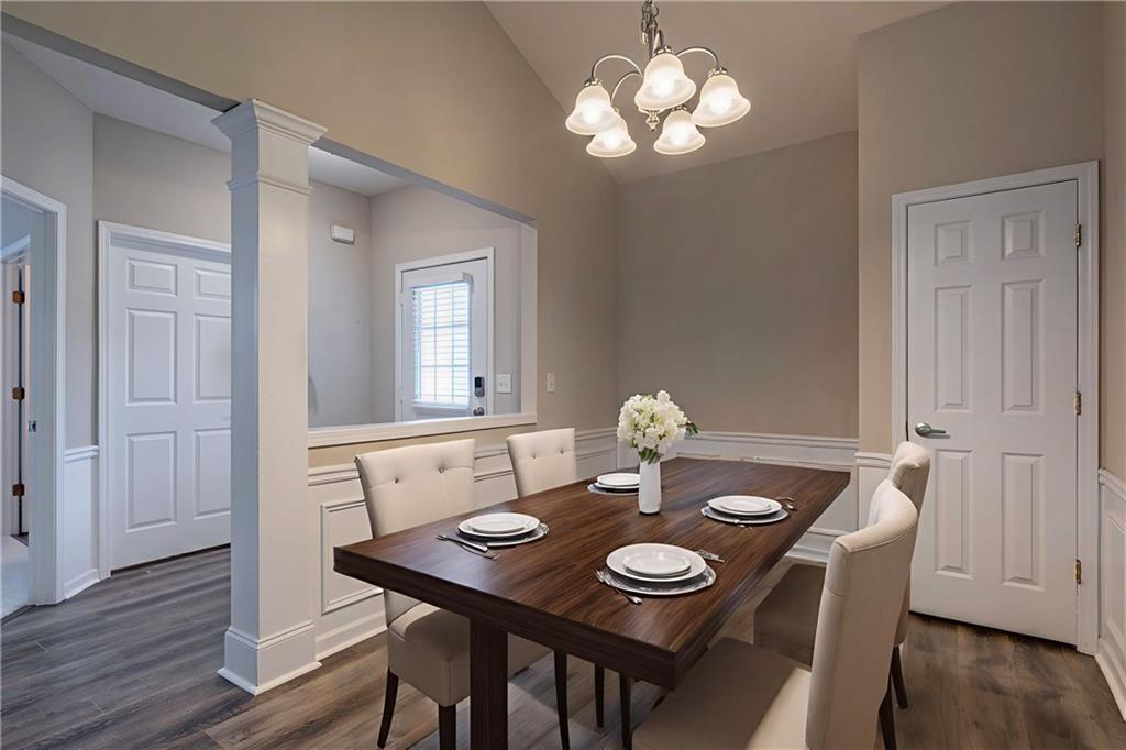 326 Camry Circle Dallas, GA 30157 - Photo 10 of 31 a view of a dining room with furniture wooden floor and chandelier