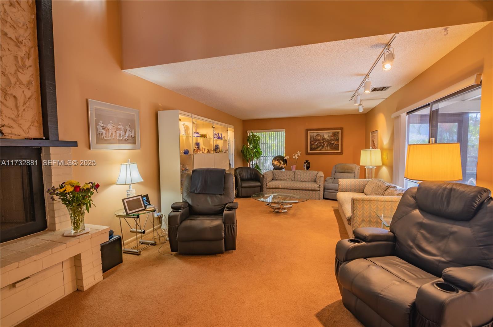 36 Eastmont Road Hollywood, FL 33021 - Photo 12 of 30 a living room with furniture a couch and a flat screen tv