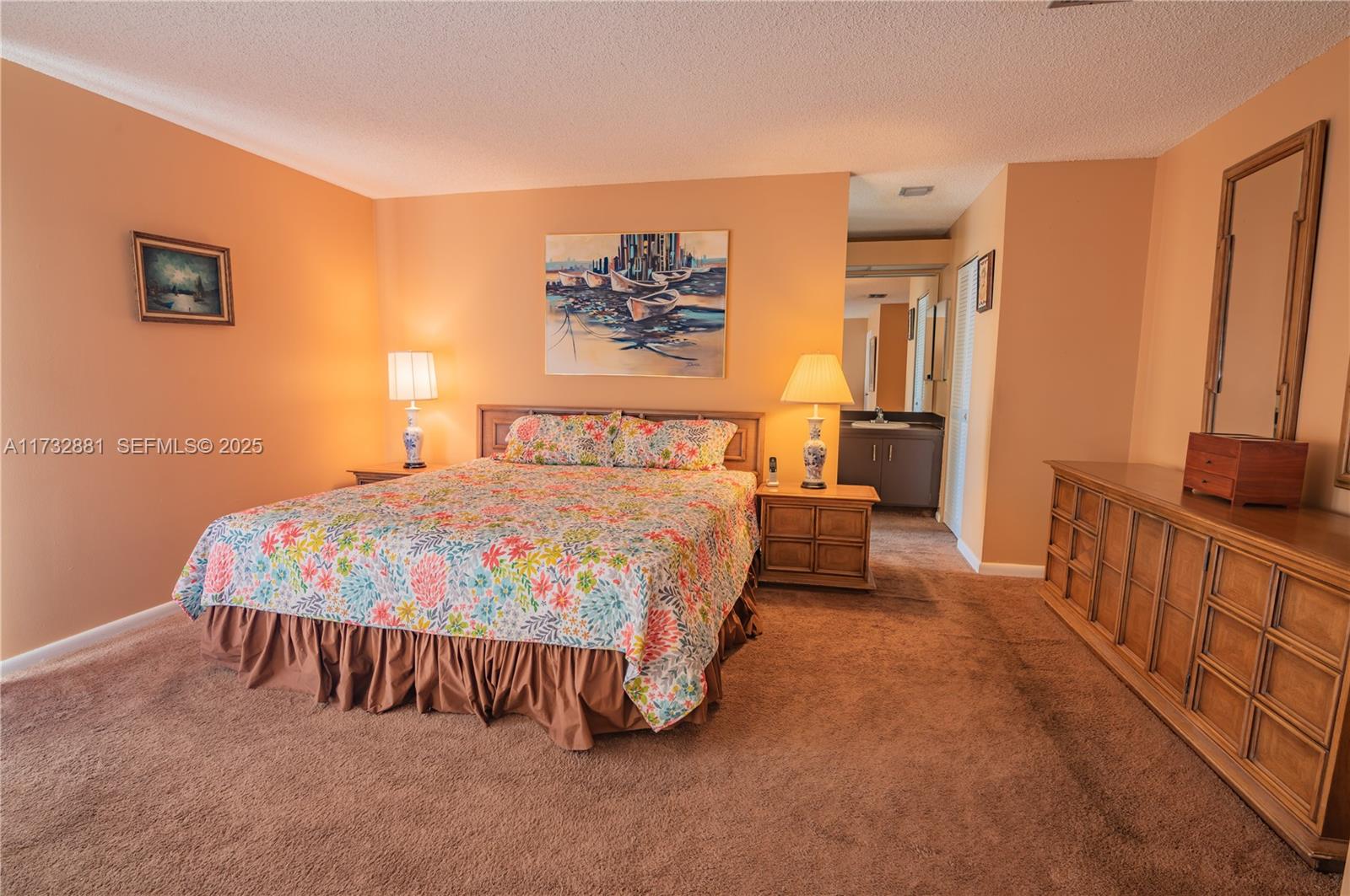 36 Eastmont Road Hollywood, FL 33021 - Photo 21 of 30 a bedroom with a bed and a night stand