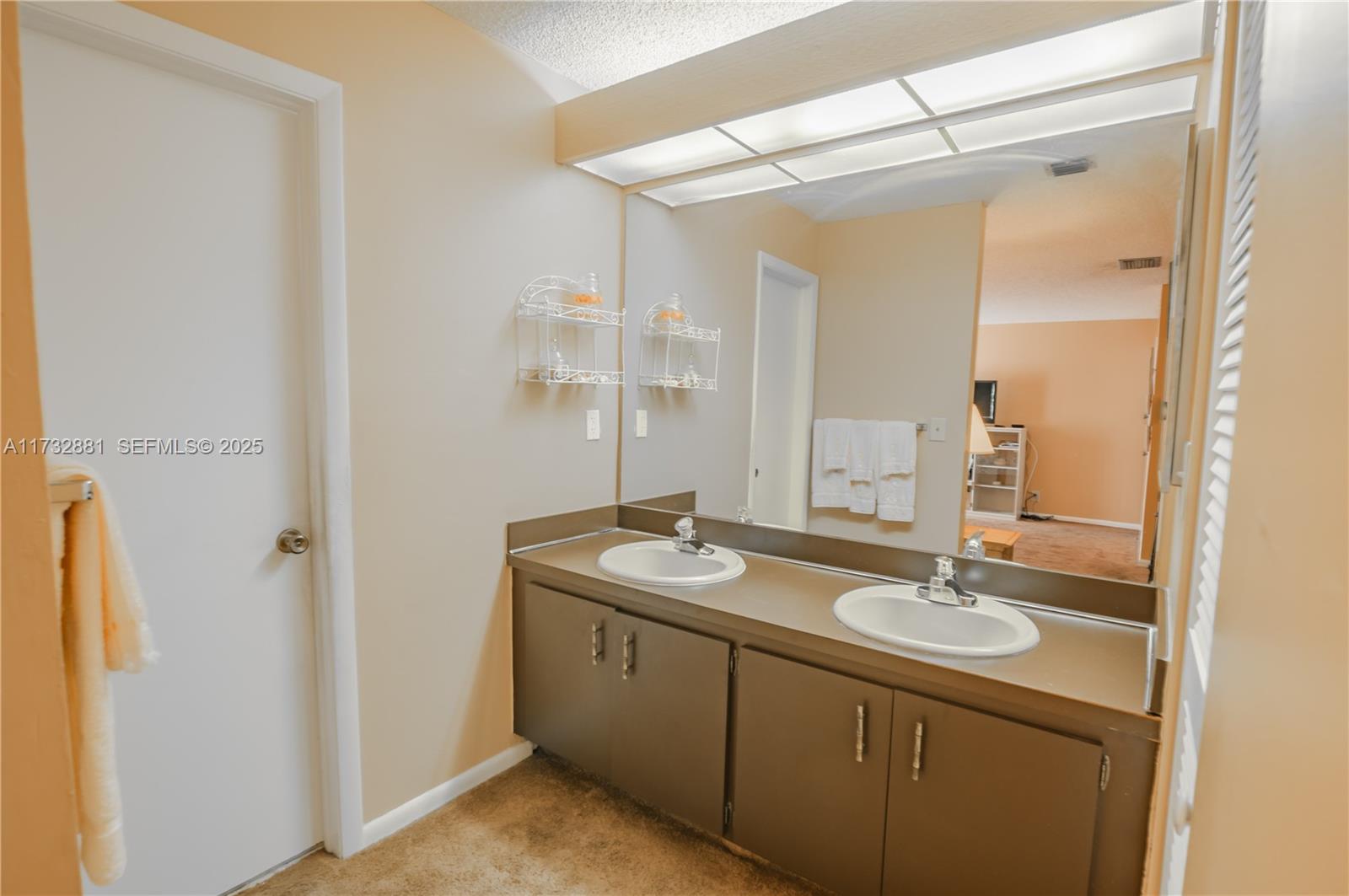 36 Eastmont Road Hollywood, FL 33021 - Photo 26 of 30 a bathroom with a granite countertop sink and a mirror