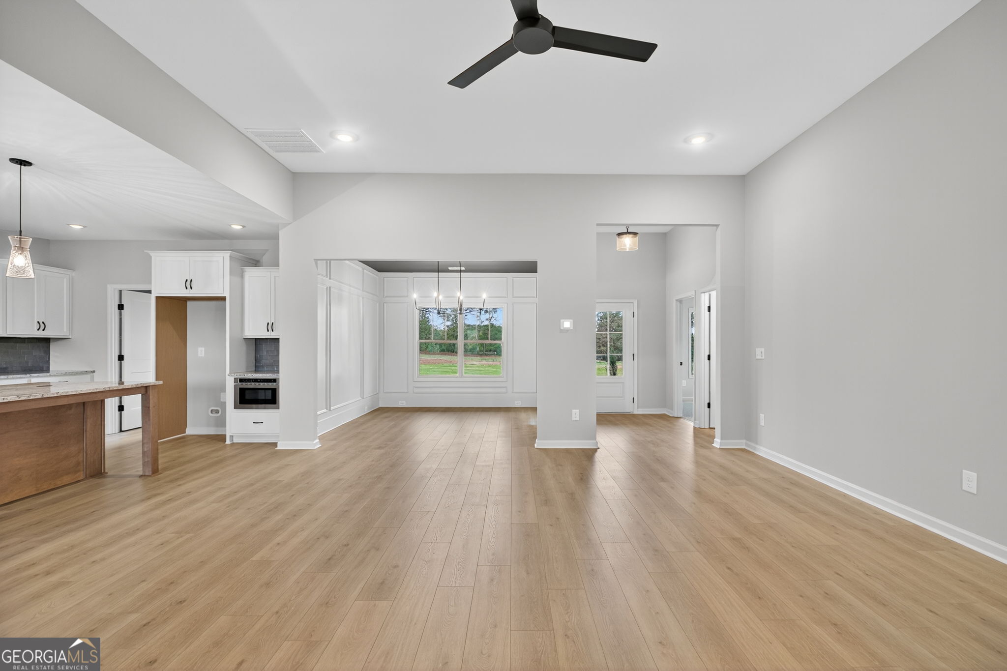 359 Gray Road Roopville, GA 30170 - Photo 14 of 46 a view of an empty room with a kitchen