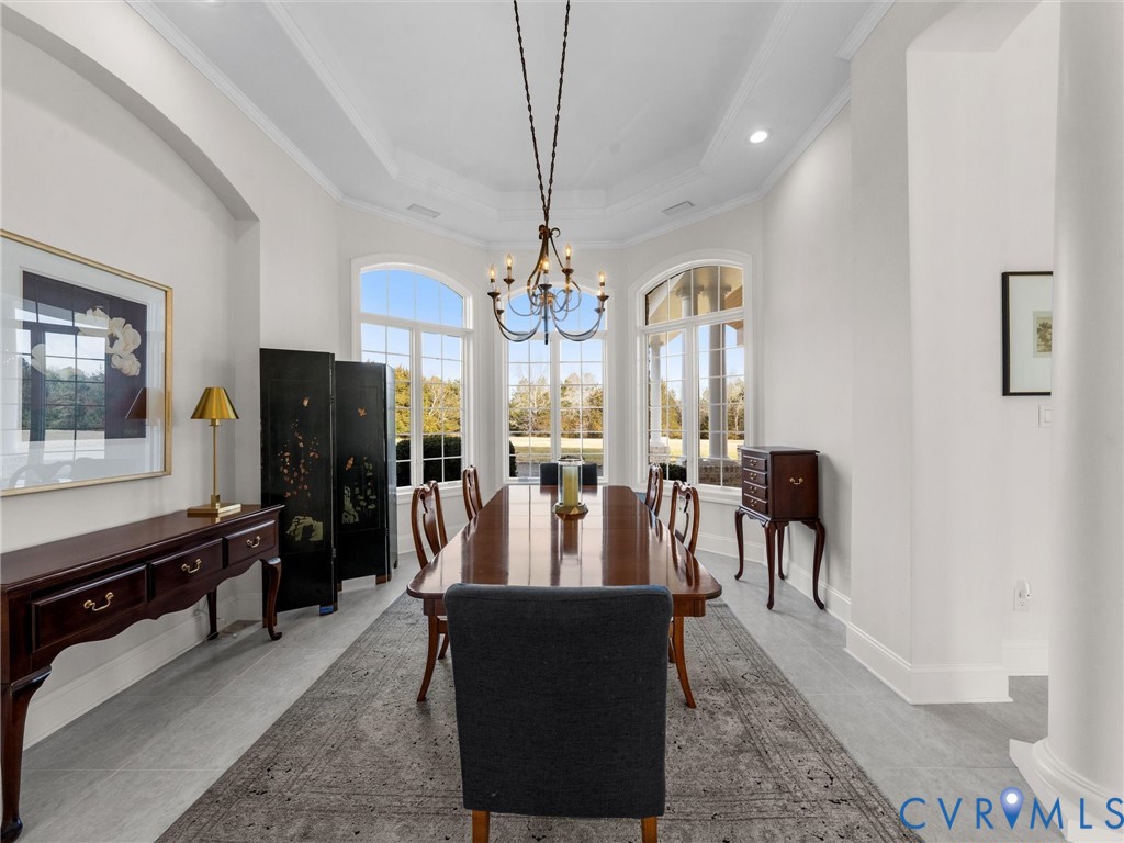 15219 Deep Spring Drive Montpelier, VA 23192 - Photo 12 of 51 a view of a dining room with furniture a chandelier and wooden floor