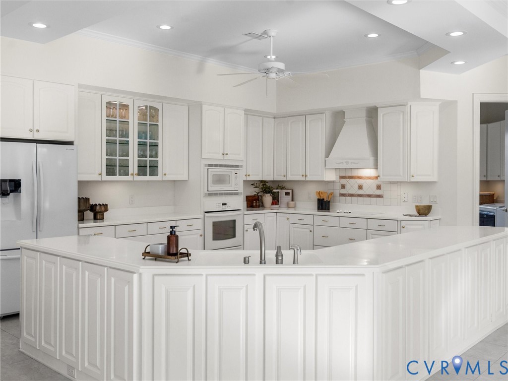 15219 Deep Spring Drive Montpelier, VA 23192 - Photo 22 of 50 CORIAN KITCHEN BAR AND CABINETRY