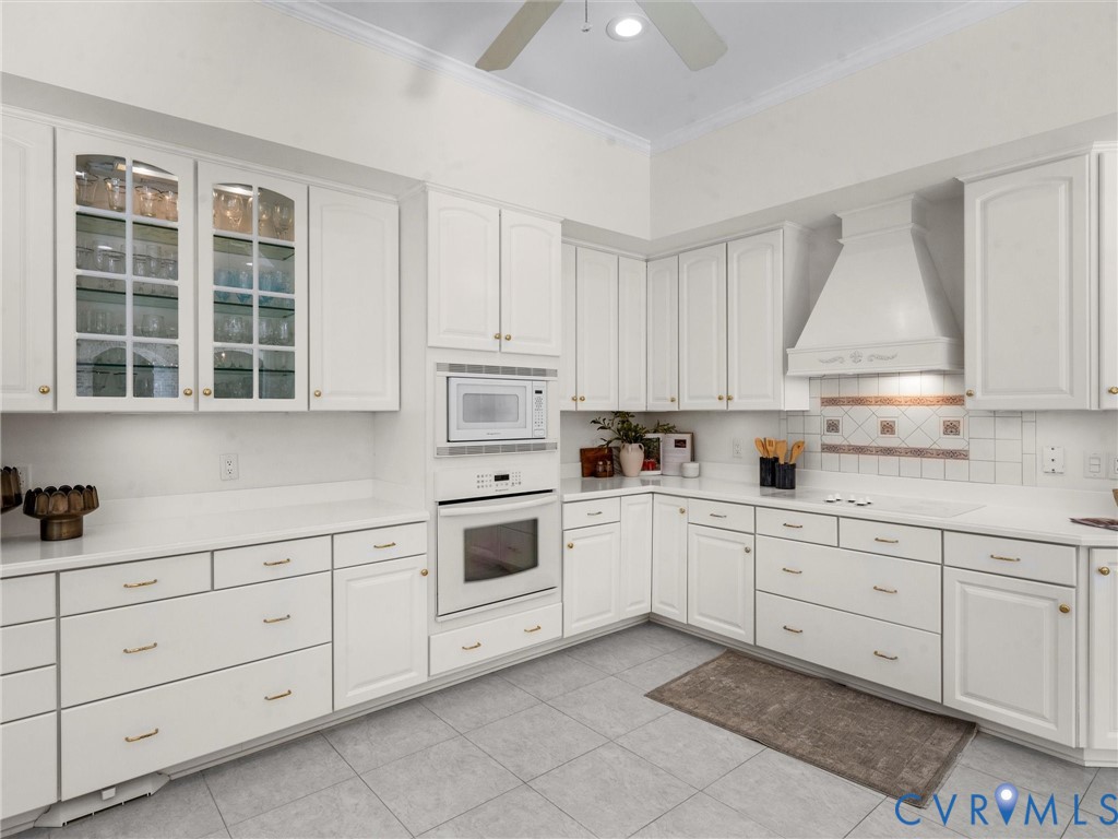 15219 Deep Spring Drive Montpelier, VA 23192 - Photo 24 of 51 a kitchen with white cabinets and white appliances