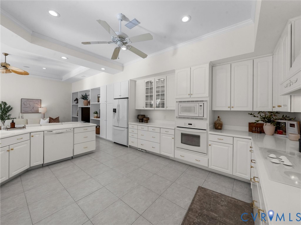 15219 Deep Spring Drive Montpelier, VA 23192 - Photo 25 of 51 a kitchen with white cabinets and white appliances