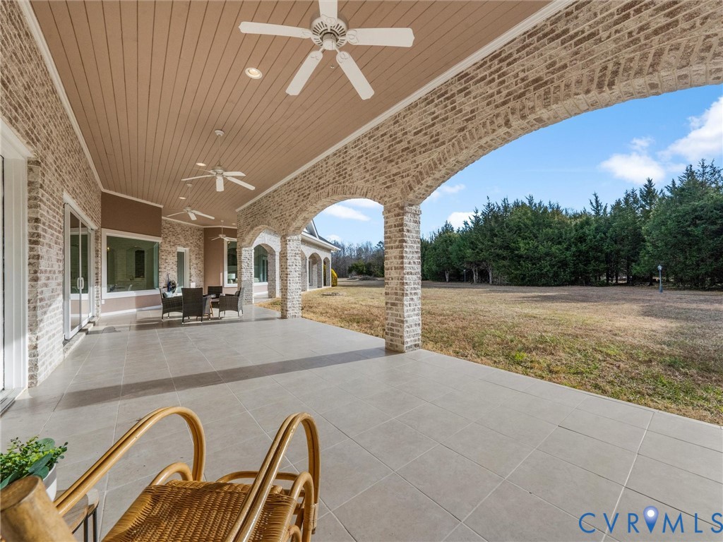 15219 Deep Spring Drive Montpelier, VA 23192 - Photo 43 of 50 COVERED VERANDA WITH PORCELAIN TILE FLOOR RUNS ACR