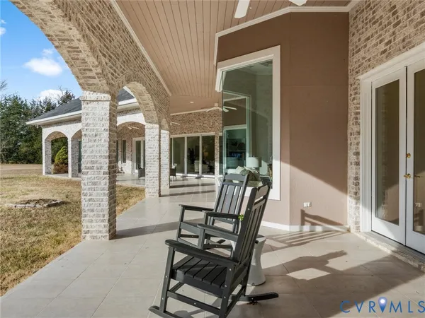 a view of a patio with a table and chairs
