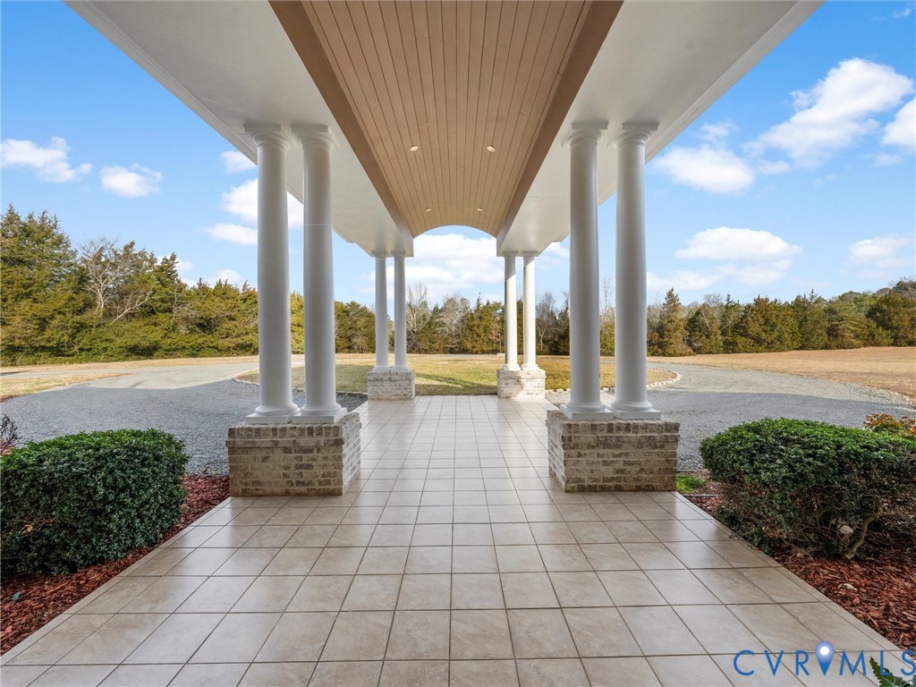 15219 Deep Spring Drive Montpelier, VA 23192 - Photo 6 of 50 POCELAIN TILED COVERED ENTRANCE OFFERS SHELTER FR