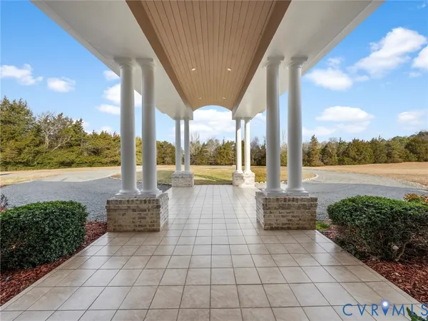 a lobby with a floor to ceiling windows and yard