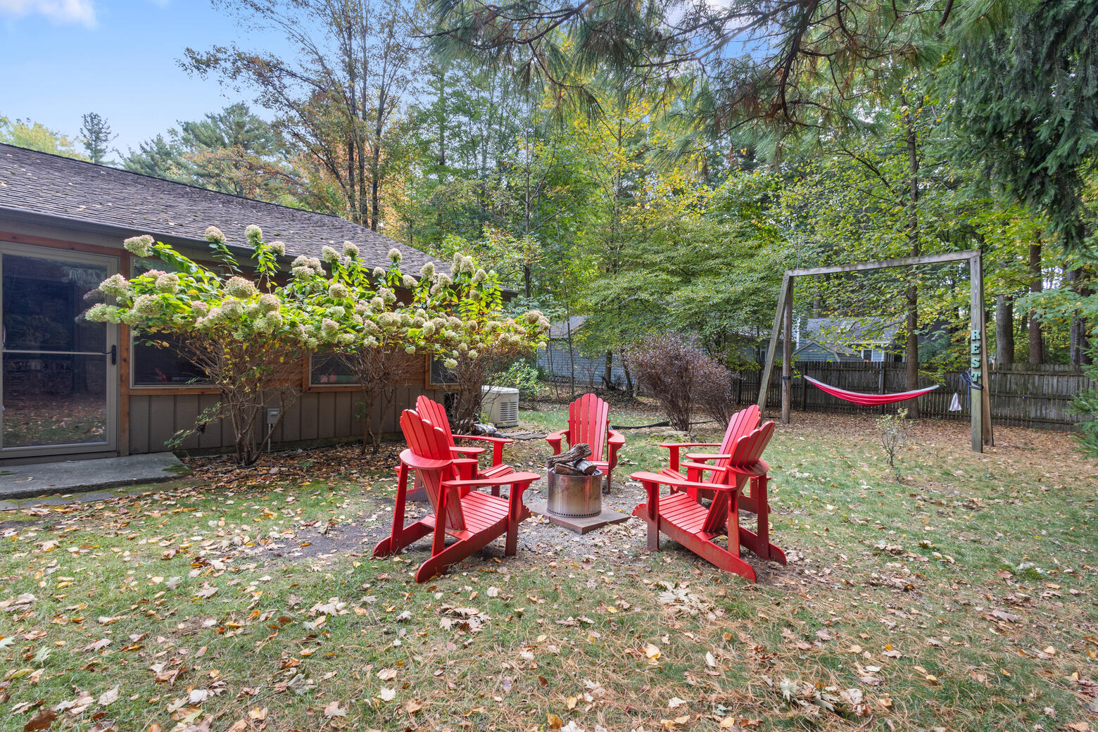 12370 Dunes Road Sawyer, MI 49125 - Photo 4 of 39 Backyard fire pit and hammock