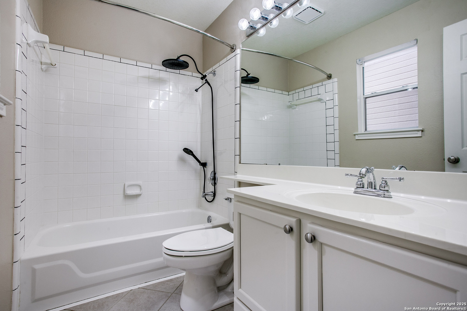 5834 Spring Crossing San Antonio, TX 78247 - Photo 15 of 29 a bathroom with a sink a toilet and shower