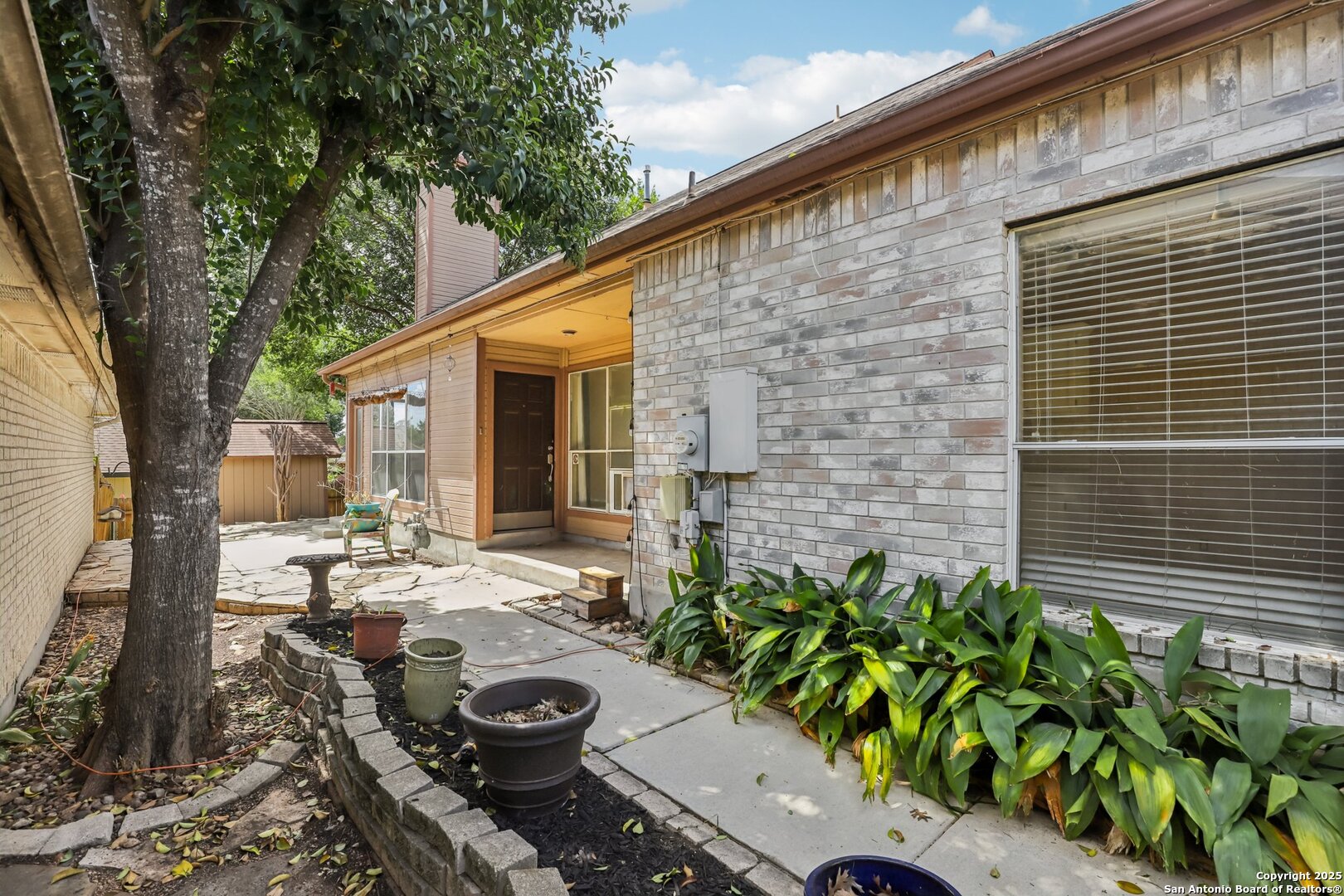 5834 Spring Crossing San Antonio, TX 78247 - Photo 19 of 29 a view of backyard of house with seating space
