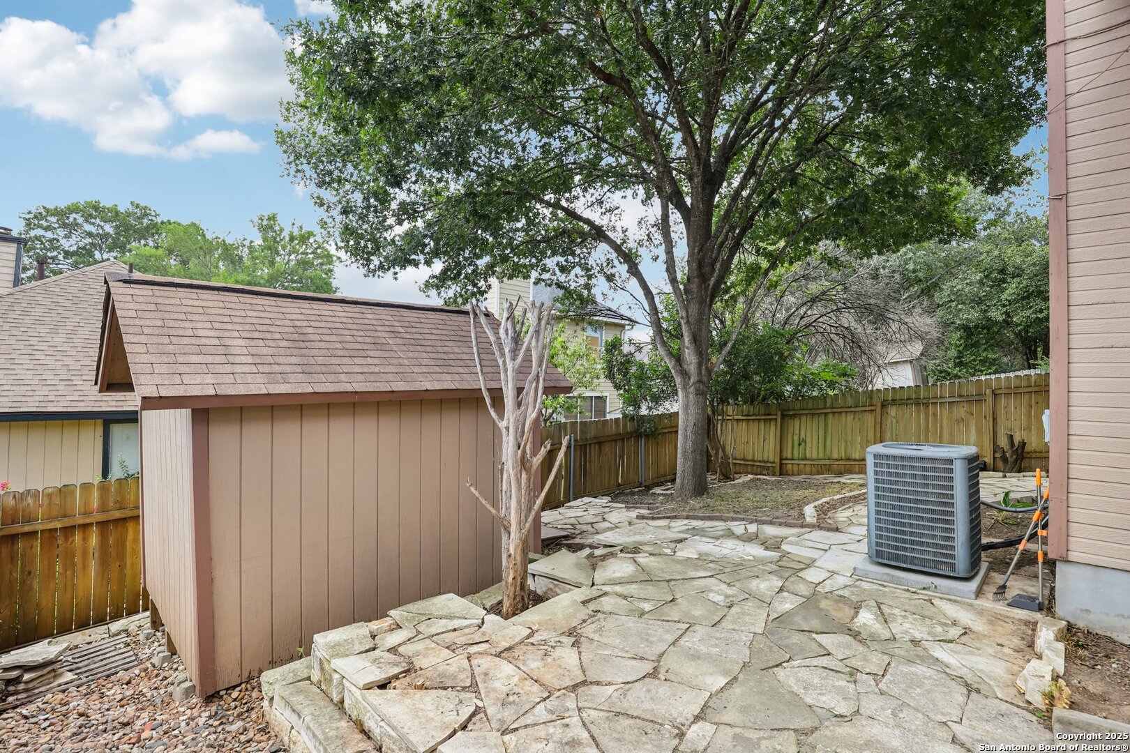 5834 Spring Crossing San Antonio, TX 78247 - Photo 20 of 29 a backyard of a house with barbeque oven and table