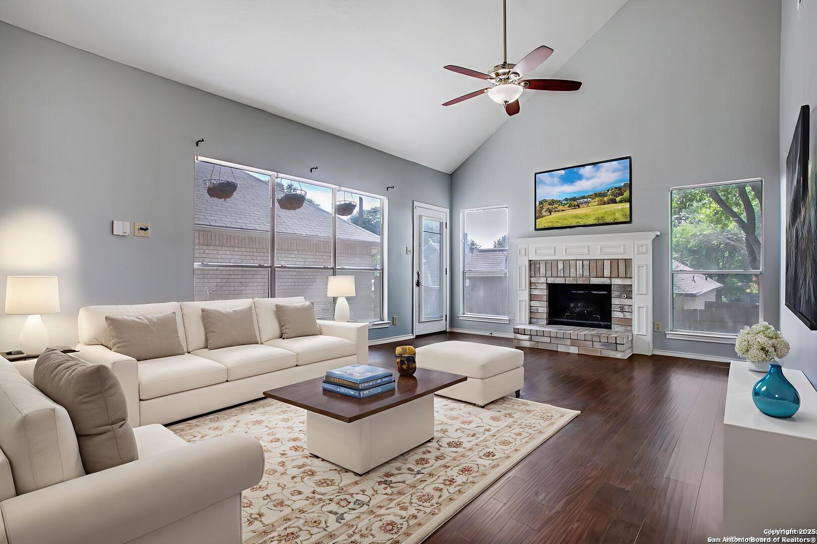 5834 Spring Crossing San Antonio, TX 78247 - Photo 7 of 29 a living room with furniture fireplace and a table