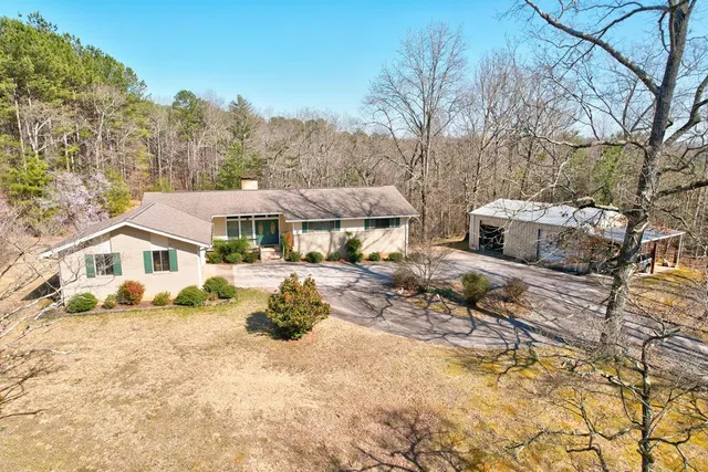 a view of house with outdoor seating