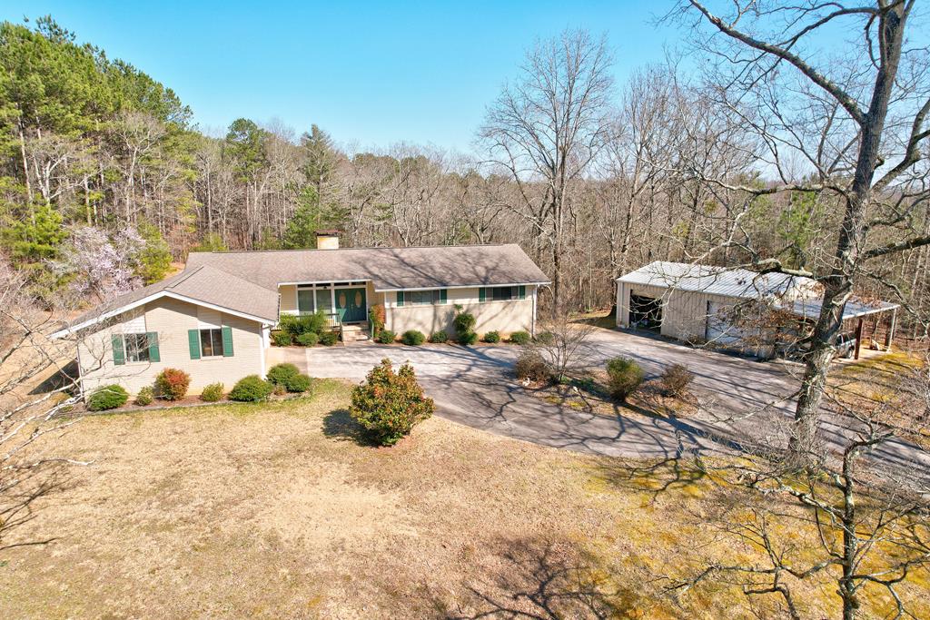 a view of house with outdoor seating