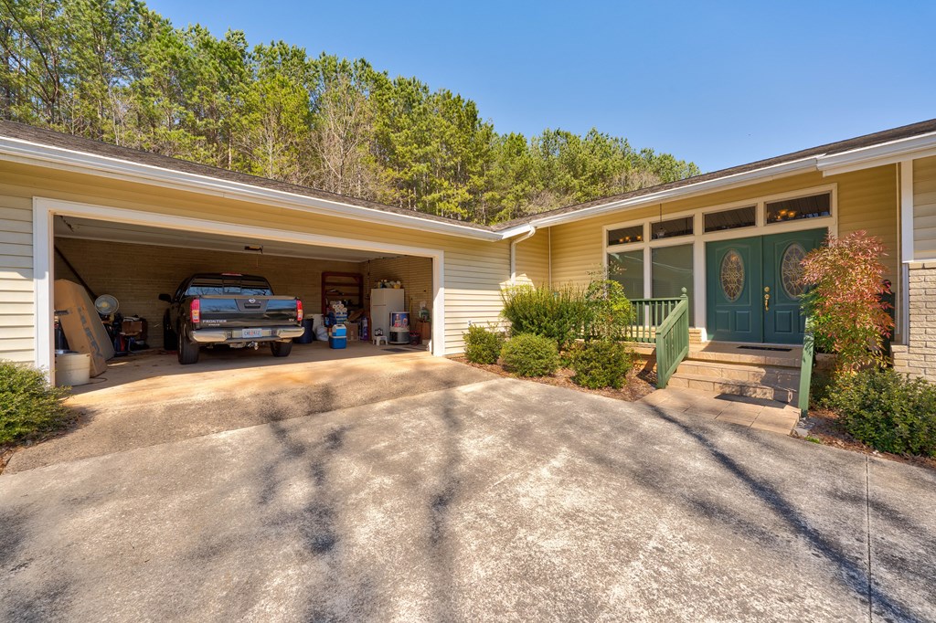 1676 Shoal Creek Road Dawsonville, GA 30534 - Photo 13 of 40 a view of a car park in front of house
