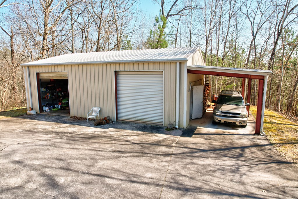 1676 Shoal Creek Road Dawsonville, GA 30534 - Photo 3 of 40 a view of a car garage