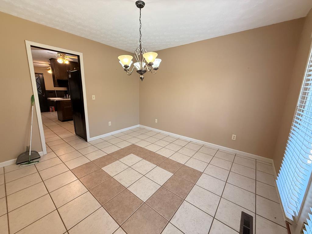 1676 Shoal Creek Road Dawsonville, GA 30534 - Photo 34 of 40 a view of an empty room with a window