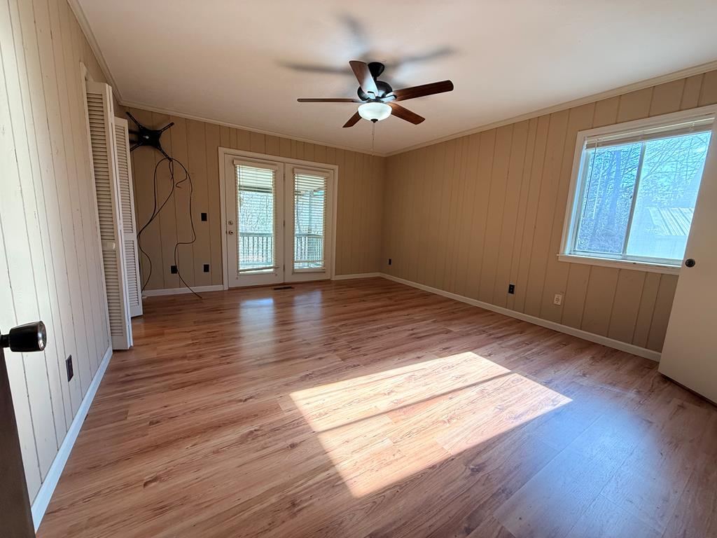 1676 Shoal Creek Road Dawsonville, GA 30534 - Photo 40 of 40 an empty room with wooden floor and windows