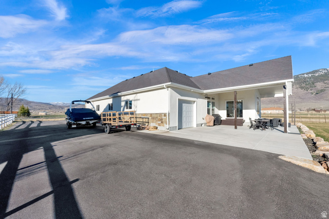 352 East Boulderville Road Oakley, UT 84055 - Photo 45 of 62 View of asphalt road featuring a mountain view