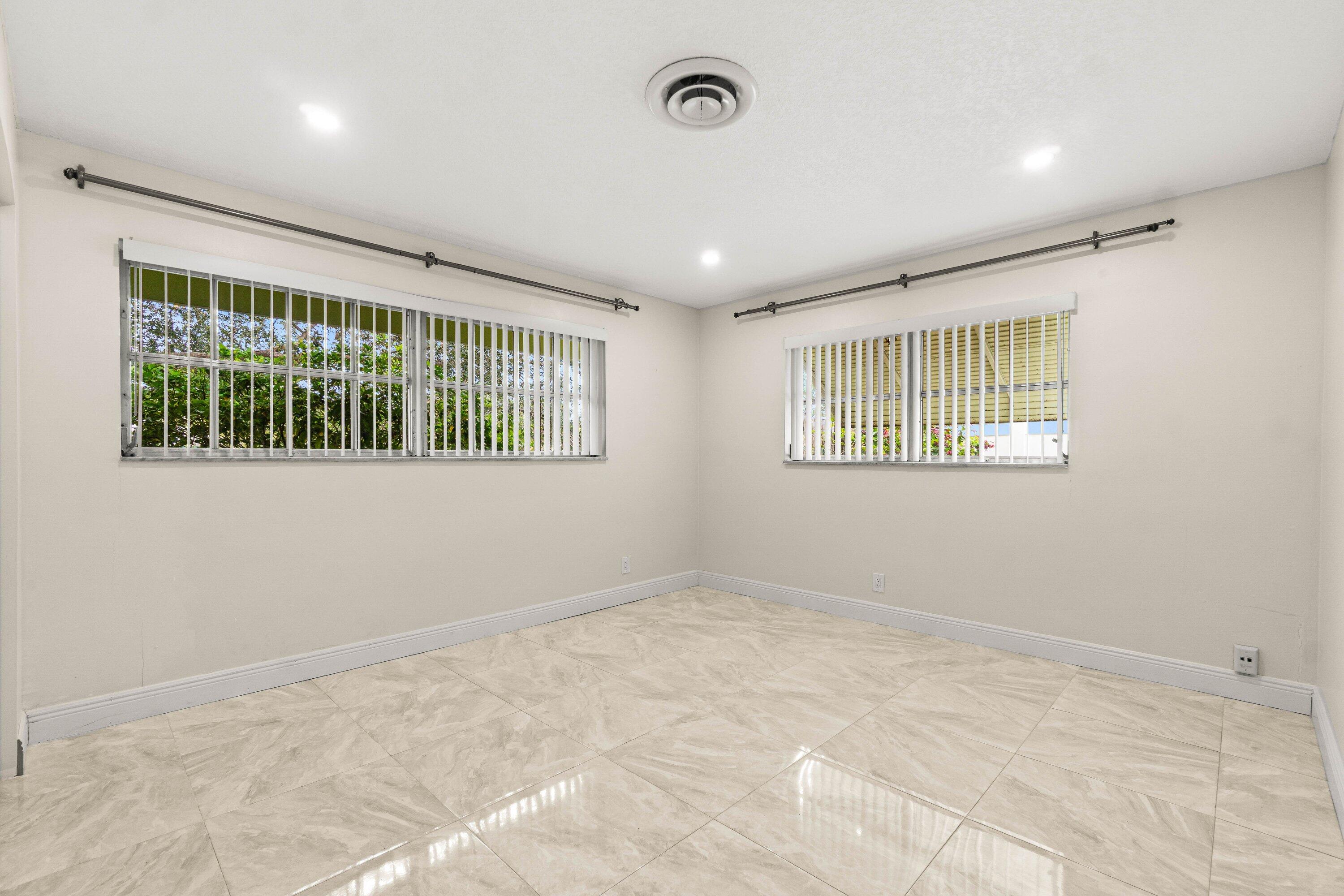 1290 Southwest 8th Street Boca Raton, FL 33486 - Photo 19 of 29 a view of an empty room with a window