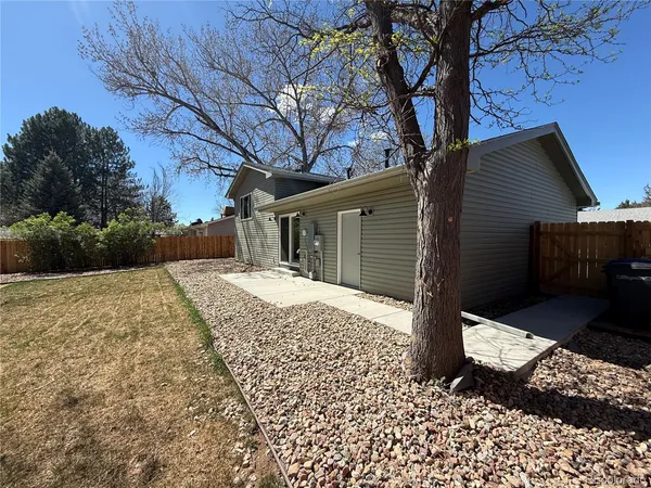 a view of a backyard of the house