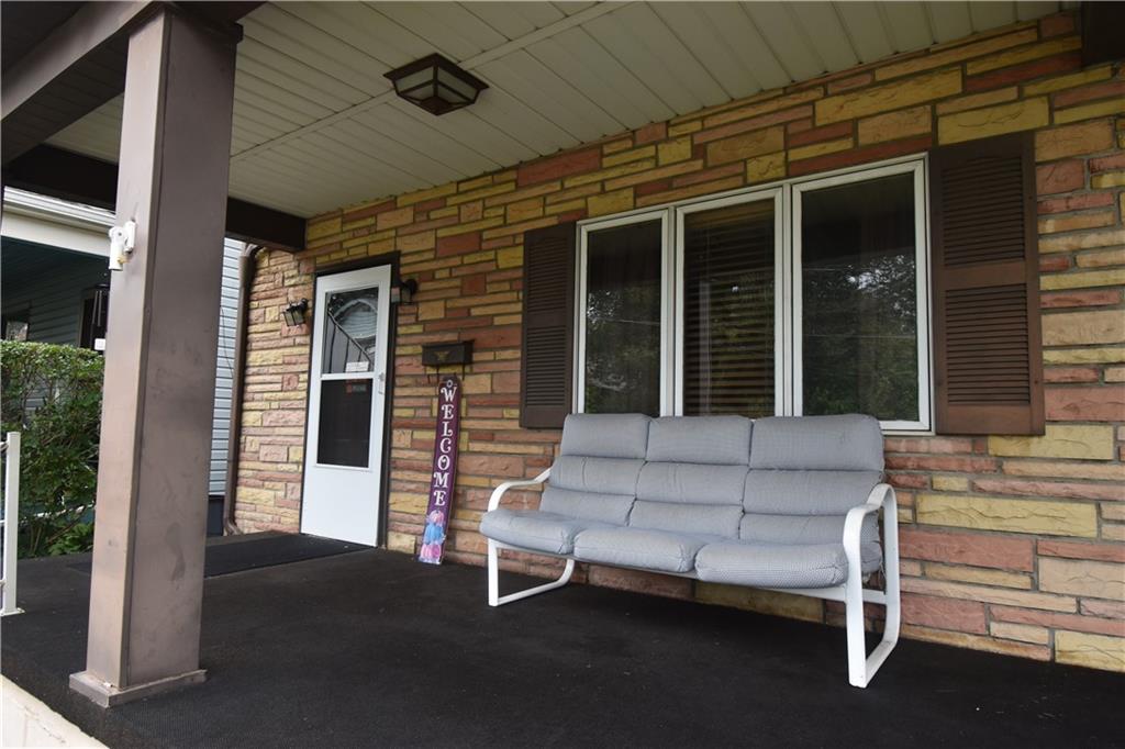 128 Hartrey Street Springdale, PA 15144 - Photo 3 of 32 Great size front porch. Family and friends all want to rest outside