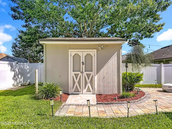 a view of a park with swings and a table