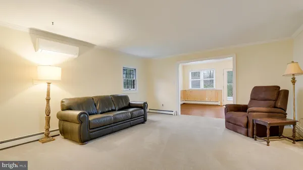 a living room with furniture and a window