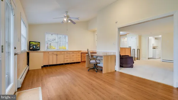 a view of a livingroom with a workspace