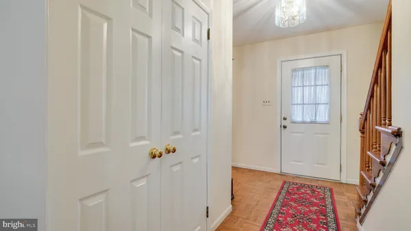 a view of an entryway with wooden floor