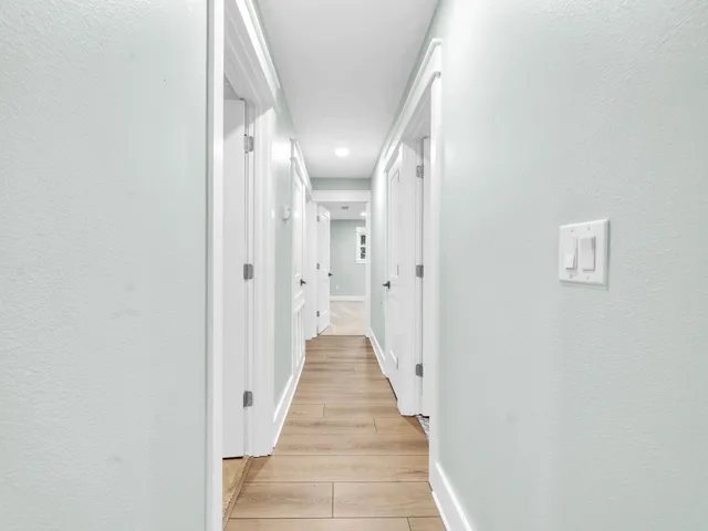 a backyard of a house with plants and tree