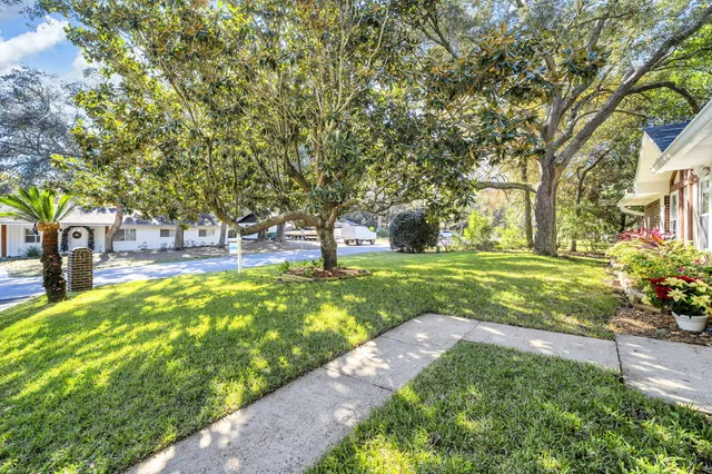 a kitchen with kitchen island a sink stainless steel appliances and refrigerator