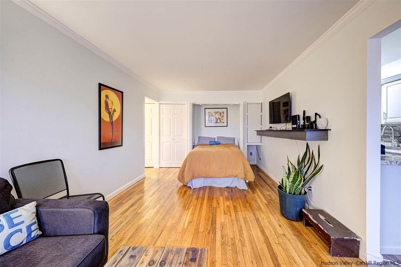 2 Colonial Road, Unit 146 Beacon, NY 12508 - Photo 6 of 13 a bedroom with a bed and wooden floor