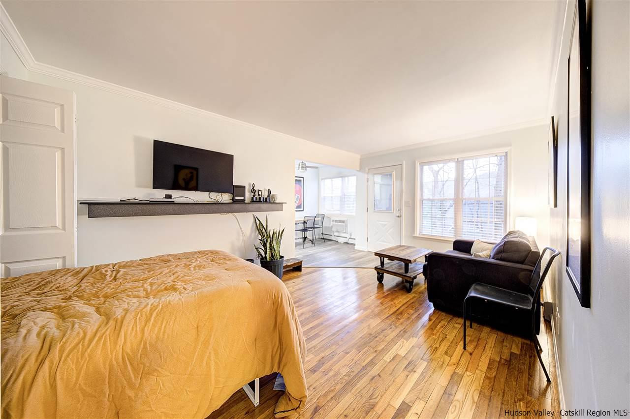 2 Colonial Road, Unit 146 Beacon, NY 12508 - Photo 7 of 13 a spacious bedroom with a bed and a flat screen tv