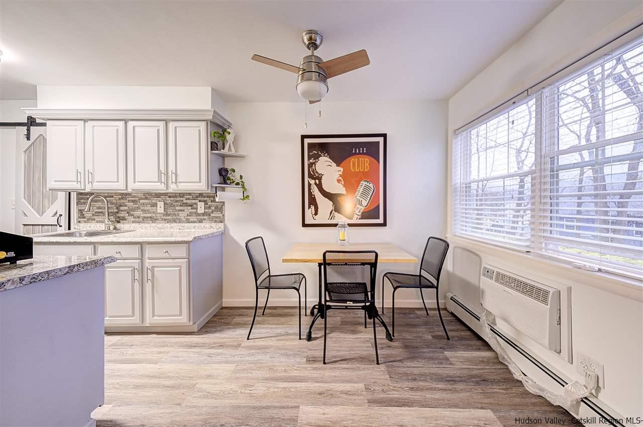 2 Colonial Road, Unit 146 Beacon, NY 12508 - Photo 8 of 13 a dining room with wooden floor and a window