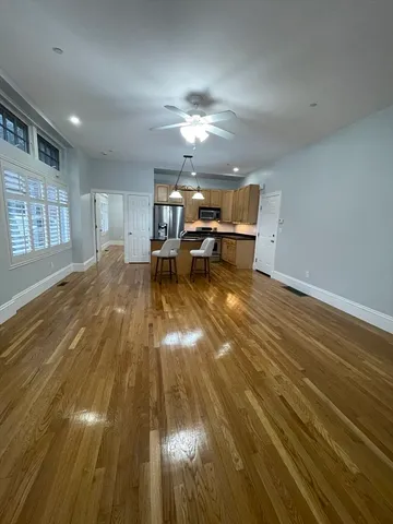 a view of a livingroom with furniture nad wooden floor